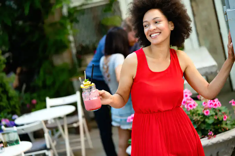 young african woman enjoy healthy vegetarian smoothie